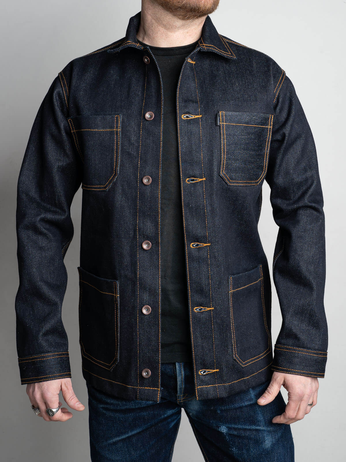 The Chore coat is a classic workwear jacket built around a practical four pocket layout, with two lower pockets sitting directly beneath the chest pockets.